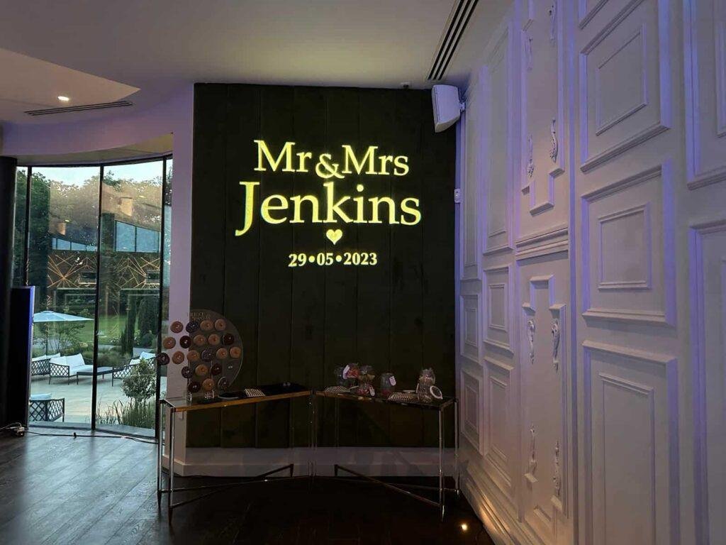 Wedding celebration sign for Mr & Mrs Jenkins at a glamorous event.