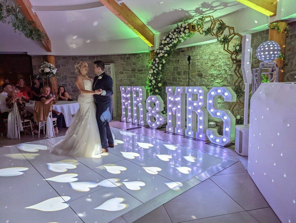 Wedding first dance with DJ lighting and dance floor
