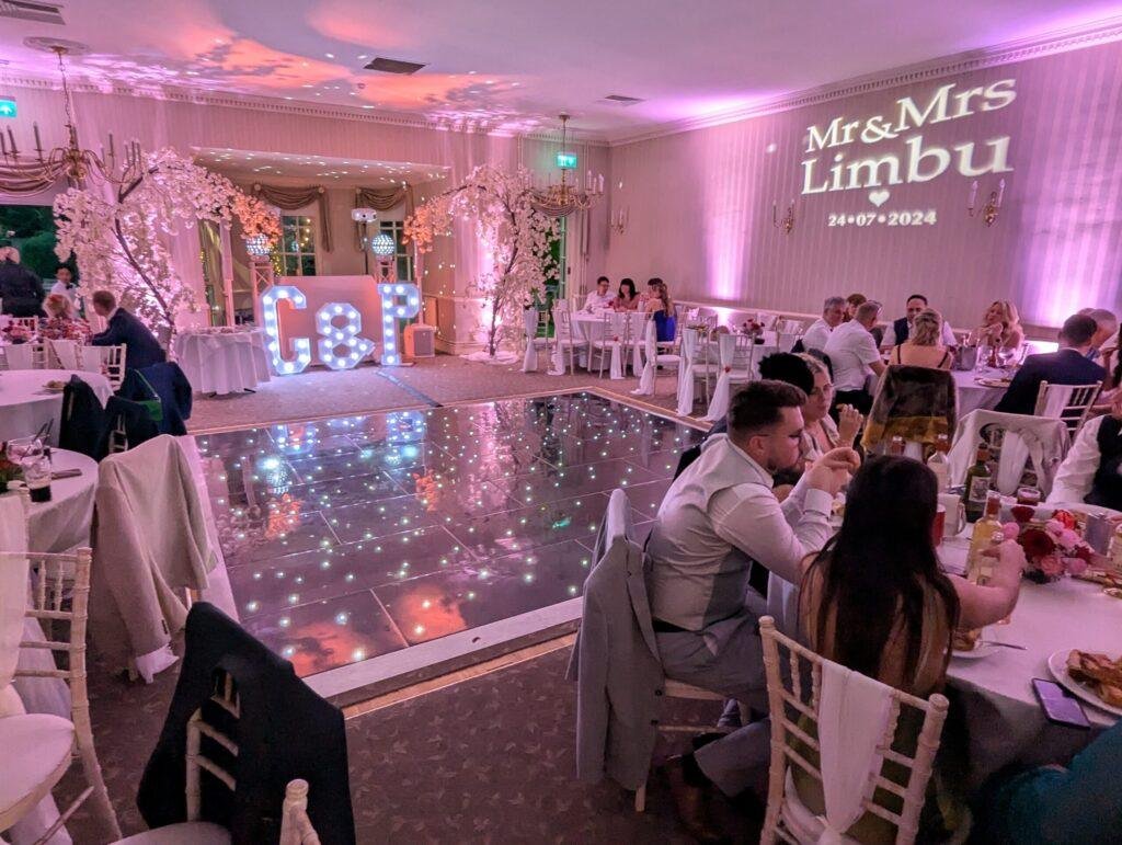 A J Wedding Entertainment setup at De Courceys Manor function room supplying Wedding DJ, LED Light Up Dance Floor, Light Up Letters, Uplighting, Name in Lights (Monogran Projection)
