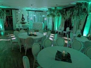 Elegant wedding reception setup with ambient lighting and floral decor.